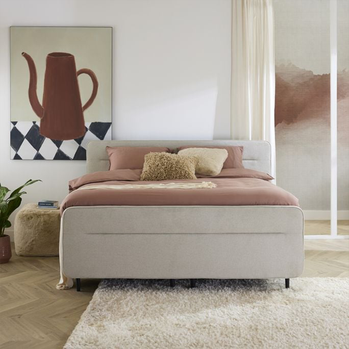 Boxspring met roze dekbed